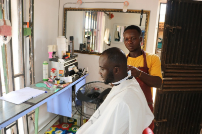 Sunday giving a client hair-cut